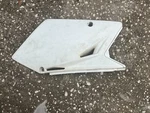 Genuine Oem 05-06 Suzuki RMZ450 Model K7 Left White Side Cover 47211-35G10-30H. Fixed Price $15.00.