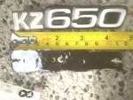 Pair Side Cover Metal Emblems Kawasaki KZ650 1977-79, #56018-256. Fixed Price $55.00.