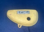 1973 Suzuki TC100 Left Side Cover / Panel Pt# 47111-25300-019. Fixed Price $15.00.