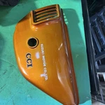 Suzuki GT185 Left Side Cover 1974 Tahiti Orange 47211-3600. Fixed Price $110.00.